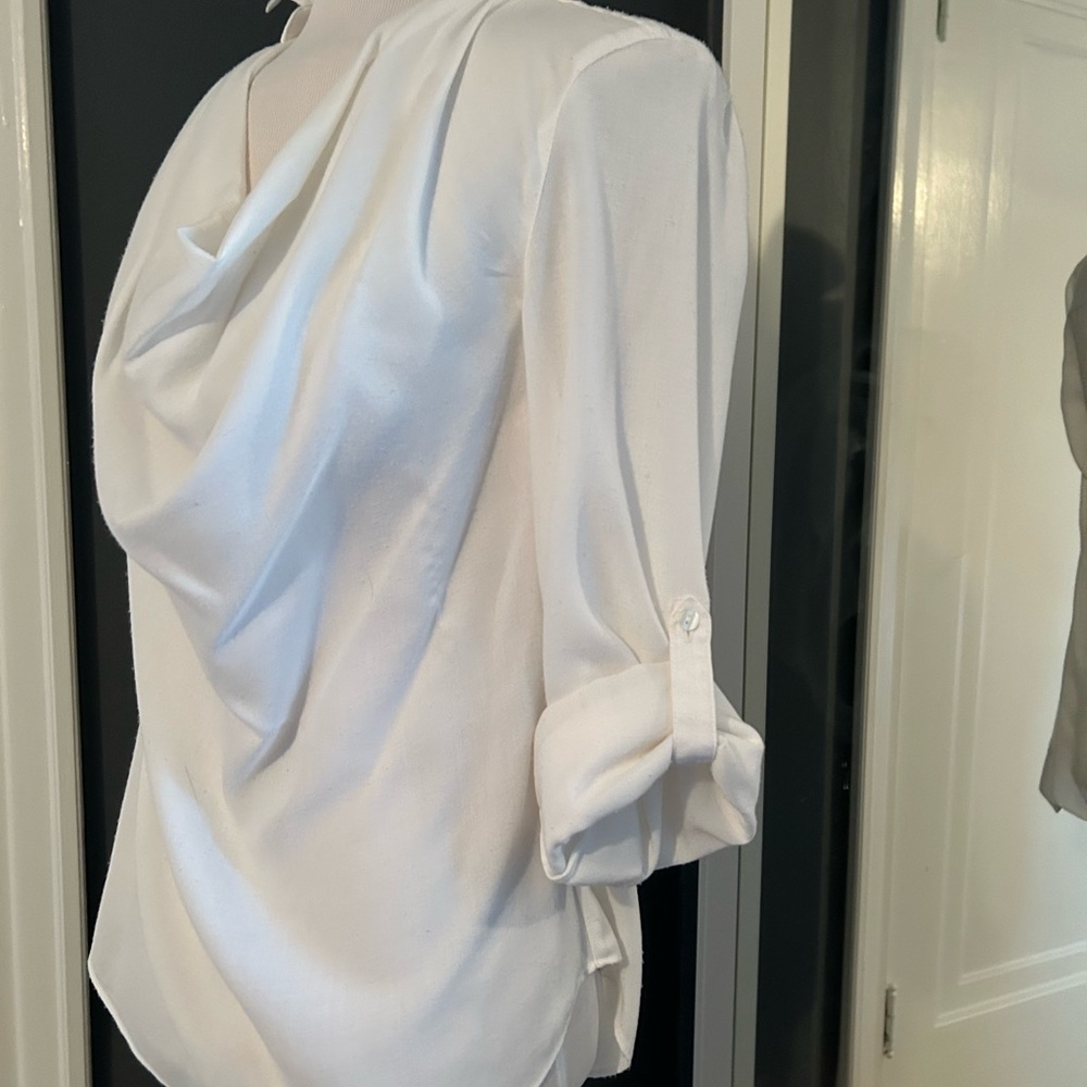 Beautiful light weight white cotton long or roll sleeve blouse. Dressy or casual